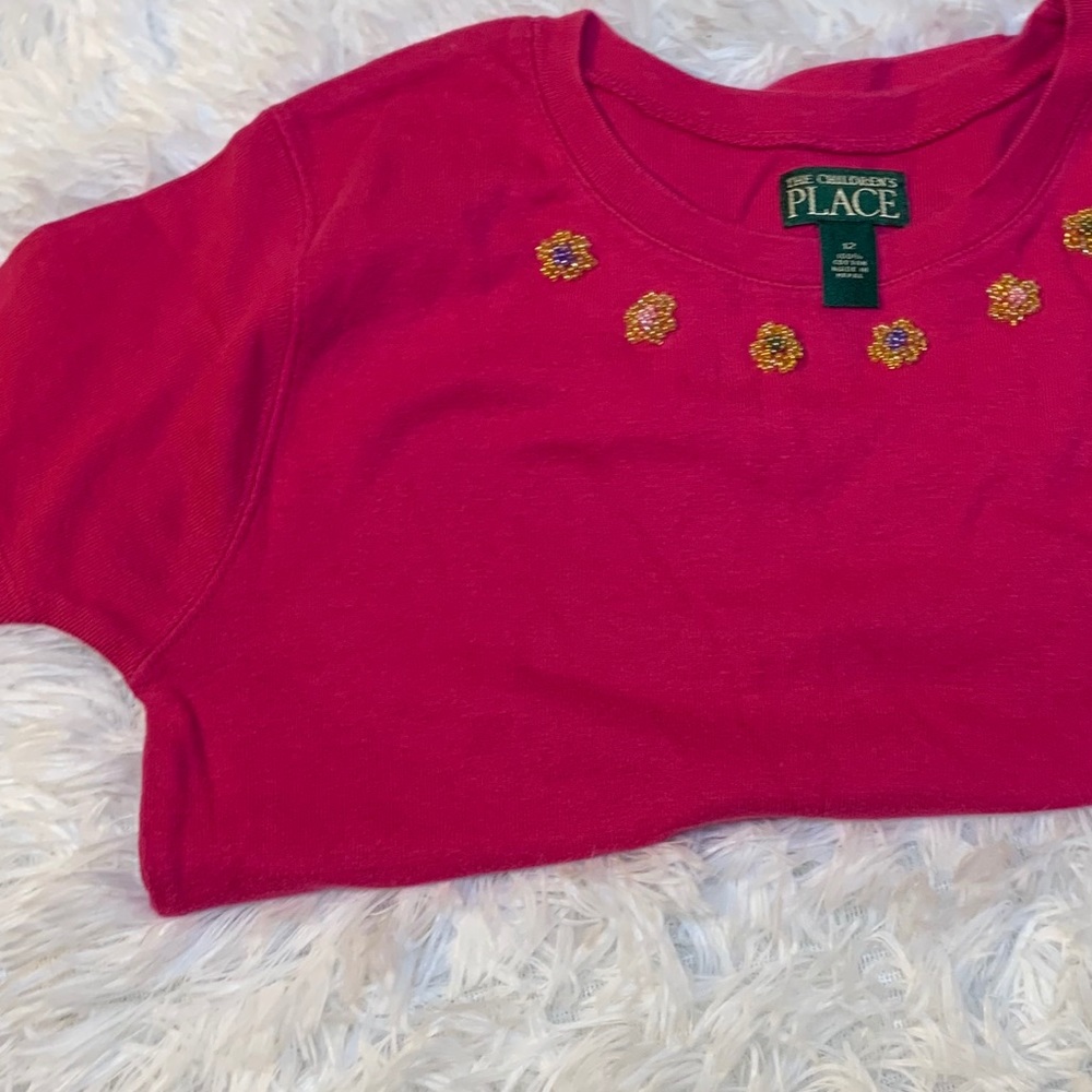 Pink shirt with beaded flowers